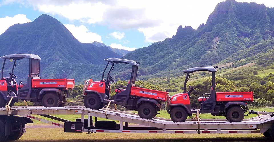 image of a rental trailer from Nohokai being used to transport UTVs.